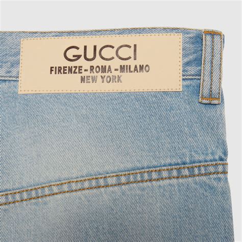 etichetta gucci giubbino|Pantalone in denim con etichetta Gucci in blu .